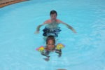 Nikijifunza swimming with daddy, Sunrise Beach Resort pool summer holiday 2010