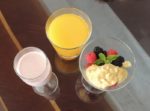 Smoothie of the day, orange juice and mix berries with mango muesli
