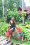 With my kids, behind is our hotel villa