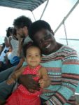 Baby Malaika with aunt Judy on the boat to Bongoyo Island